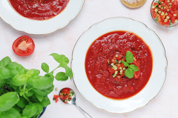 Plates with traditional gazpacho tomato soup