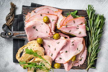 Toast with pork Ham and olives. White background. Top view. Copy space