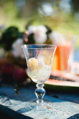 Flower buds in a glass glass on a sunny day