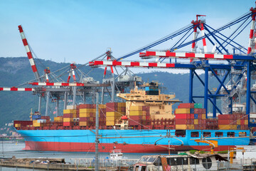 containers ship discharging and loading container cargo at harbor terminal. - 524445444