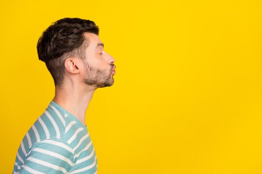 Profile photo of romantic guy kiss promo wear striped t-shirt isolated on yellow color background