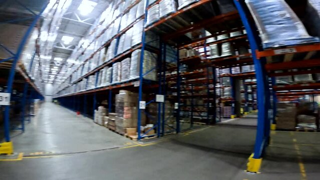 Very large warehouse with high shelves. ILarge warehouse with goods. nside a large warehouse. Modern warehouse