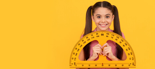 happy teen girl hold school math tool protractor ruler on yellow background, geometry. Banner of...