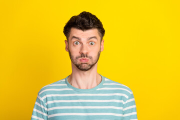 Photo of impressed guy look wear striped t-shirt isolated on yellow color background