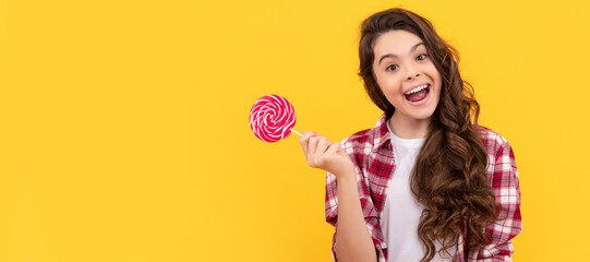 lollipop child. hipster kid with long curly hair hold lollypop. sugar candy on stick. Teenager...