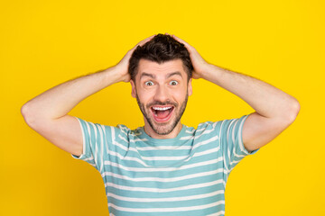 Fototapeta na wymiar Closeup photo of young funny celebrating man shocked how low price buy new car isolated on yellow color background