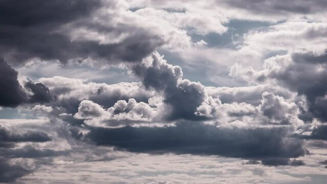 Timelapse of cumulus clouds moving in the blue sky. Fluffy clouds change their shape in cloud space. Awesome sky. Background of cloudscape, time-lapse. Copy space. Change of weather. Nature. 4K