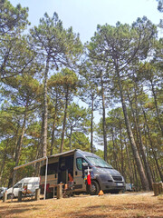 camper van in a forest camp site.