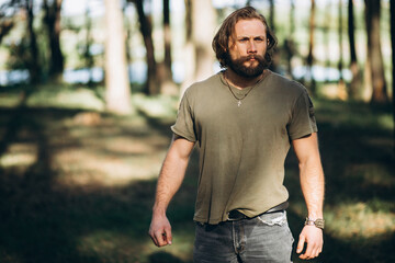 Portrait of handsome man in forest