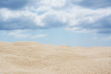 Fototapeta na wymiar Beautiful view of sand in desert under cloudy sky