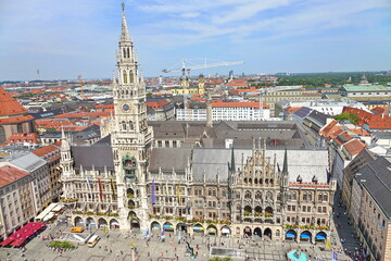 Fototapeta na wymiar Panoramic view of the old medieval Gothic architecture City Hall building at Marienplatz. Square. Munich, GERMANY - August 2022