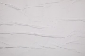 Obraz premium Top view of white creased blank poster as background, closeup