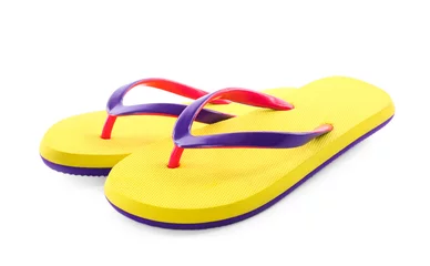 Tuinposter Pair of stylish yellow flip flops isolated on white. Beach object © New Africa