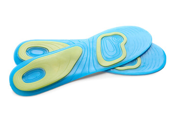 Light blue orthopedic insoles isolated on white