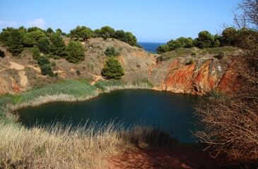 Fototapeta na wymiar Italy, Salento: Small bauxite lake near Otranto.