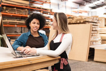 black business woman discussing sales report and delivery of product at storehouse