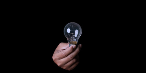 Hand holding lightbulb.