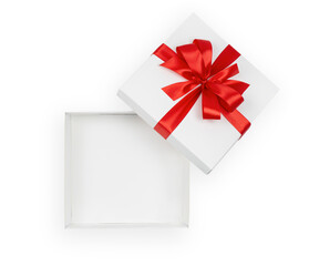 White open gift box with red ribbon isolated on white background, copy space