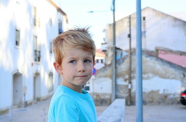 The blond boy pursed his lips and looked sadly into the distance. A pensive five-year-old boy. 