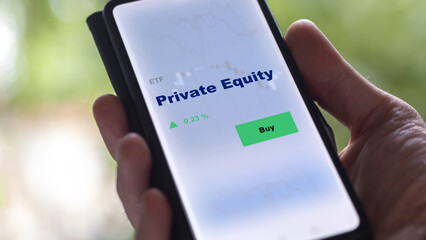 An investor's analyzing the private equity etf fund on screen. A phone shows the private equities...