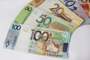 Banknotes in denominations of 100,50,20,10.5 belarusian rubles on an grey background