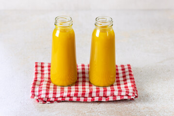 Bottle of tasty Pumpkin Smoothie or Drink on Napkin Healthy Detox Drink Horizontal