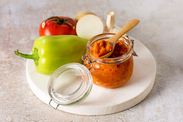 Natural Homemade Sauce of Tomatoes Peppers Onion Garlic Tasty Vegetable Sauce Wooden Tray Concrete Background