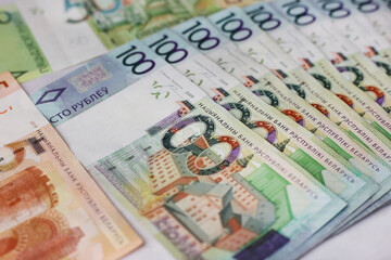 Banknotes in denominations of 100,50,20,10.5 belarusian rubles on an grey background