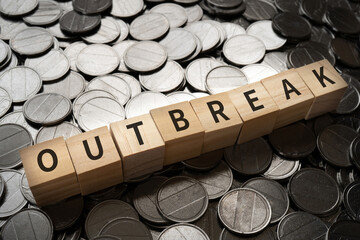 アウトブレイク・突然の発生・勃発のイメージ|「OUTBREAK」と書かれたブロックとコイン
