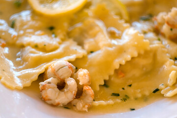 Delicious homemade ravioli filled with Adriatic sea trout and served under shrimp sauce