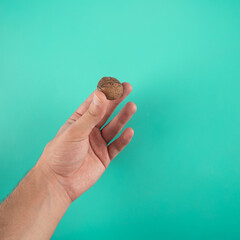Closeup shot of  walnuts in a person's hand
