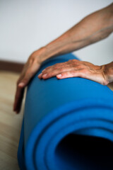 hands with yoga mat