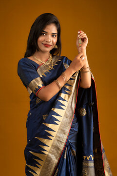 Beautiful Indian girl showing Rakhis on the occasion of Raksha Bandhan.