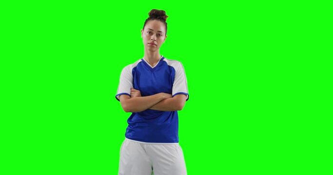 Video of portrait of caucasian female football player with copy space on green screen