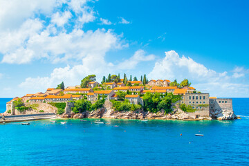 Fototapeta na wymiar Beautiful summer landscape of the Adriatic coast in The Budva Riviera with a view of the Sveti Stefan