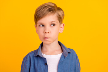 Portrait of minded doubtful person look interested empty space ponder hesitate isolated on yellow...