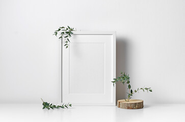 Vertical frame mockup in white interior with copy space for artwork