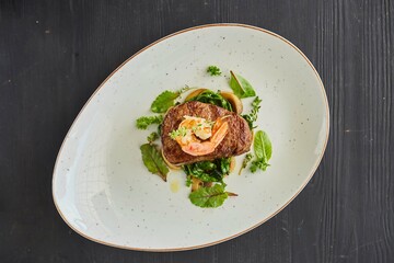 Pork, lamb or beef meatloaf with mushrooms, nuts, tomatoes and herbs. A dish from the chef for serving in a restaurant.