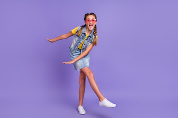 Full body photo of cool school blond girl dance wear eyewear t-shirt jeans vest skirt boots isolated on violet background