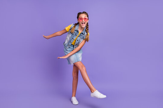 Full body photo of cool school blond girl dance wear eyewear t-shirt jeans vest skirt boots isolated on violet background