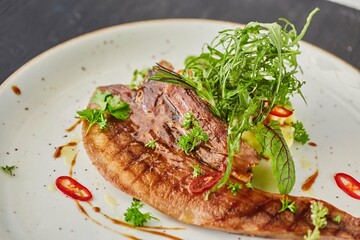 Beef tongue with sauce and herbs. A dish from the chef for serving in a restaurant.