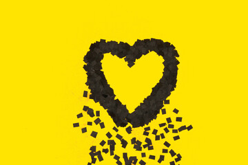 black heart melting on yellow background, art minimal design
