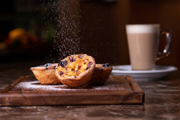Pastel de nata and latte