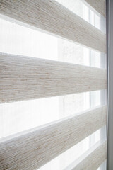 Window roller duo system day and night. Close up on roll curtains indoor.