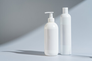 Fototapeta na wymiar Set of dispenser bottles for soap and shampoo. shampoo bottle without logo