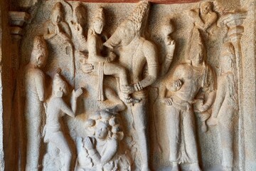 Indian rock art of bas relief sculptures of God, Animals carved in the monolithic rock cut cave temples in Mahabalipuram, Tamilnadu, India. Ancient historical relief sculptures in Tamilnadu.