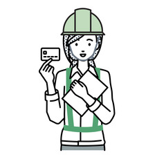 立って書類とカードを手に持つ工事現場の女性