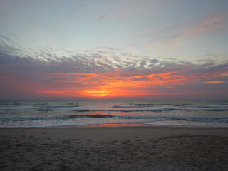 Naklejka na ściany i meble Beautiful sunrise over ocean while on vacation at the beach in South Carolina