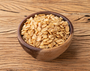 Fried soy beans snack in a bowl over wooden table