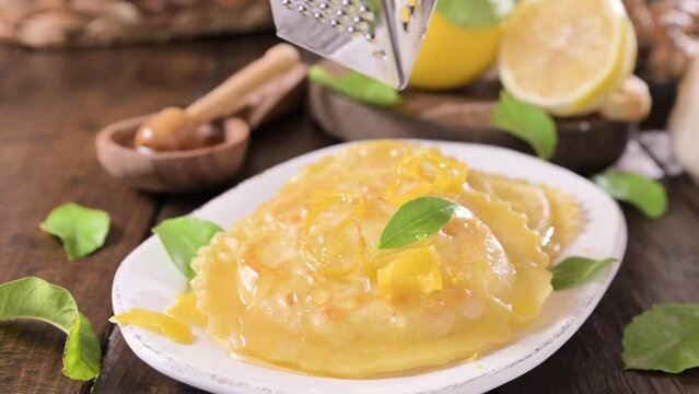 Seadas, traditional sardinian dessert with pecorino cheese, honey and lemon. Round meal with cheese, traditional in italy of the Sardinia region and south of italy. High quality 4k footage